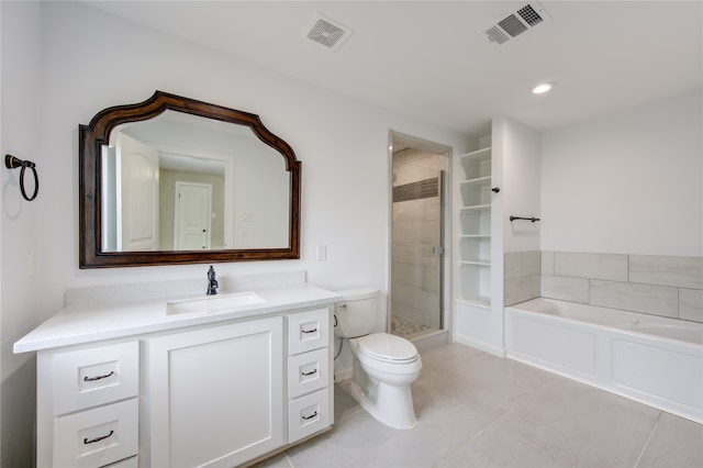 full bathroom featuring toilet, plus walk in shower, vanity, and tile patterned flooring