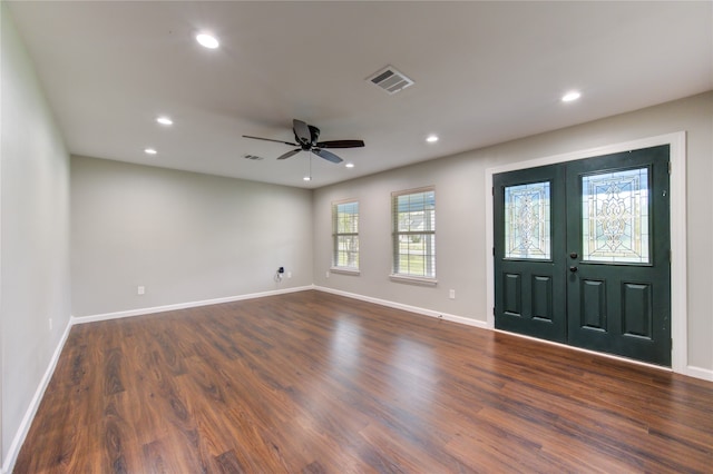 foyer entrance featuring french doors, dark hardwood / wood-style flooring, and ceiling fan