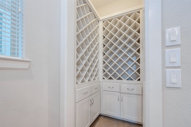 wine area with light wood-type flooring