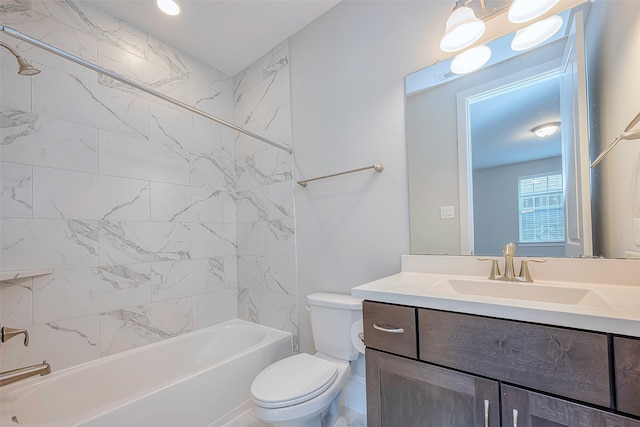 full bathroom featuring toilet, tiled shower / bath combo, and vanity