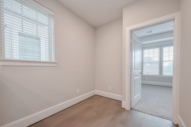 spare room with light hardwood / wood-style flooring