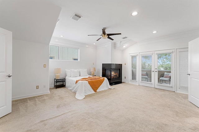 carpeted bedroom with access to outside, lofted ceiling, and ceiling fan