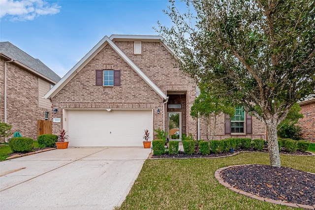 front of property featuring a garage and a front yard