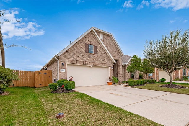 front facade featuring a garage and a front yard