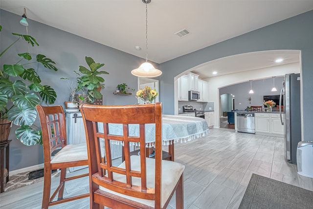 dining space featuring light hardwood / wood-style flooring