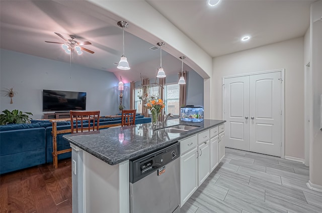 kitchen with dishwasher, white cabinets, sink, a kitchen island with sink, and pendant lighting