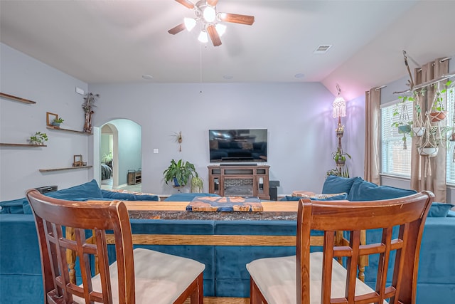 living room featuring lofted ceiling and ceiling fan