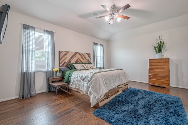 bedroom with dark wood-type flooring, ceiling fan, and lofted ceiling