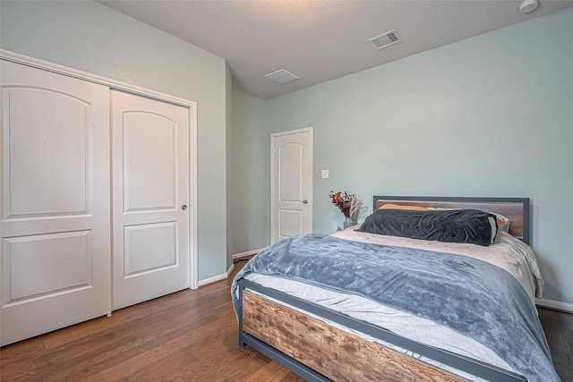 bedroom featuring a closet and wood-type flooring