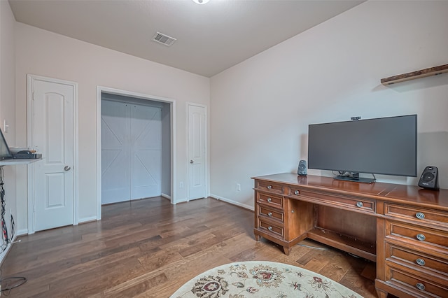 office space with dark hardwood / wood-style floors