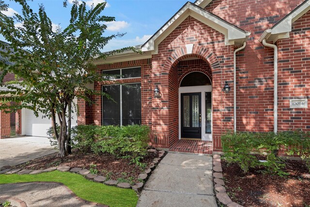 view of exterior entry featuring a garage