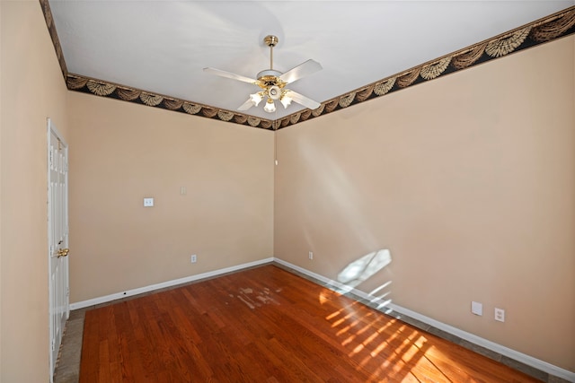 empty room featuring ceiling fan and wood-type flooring