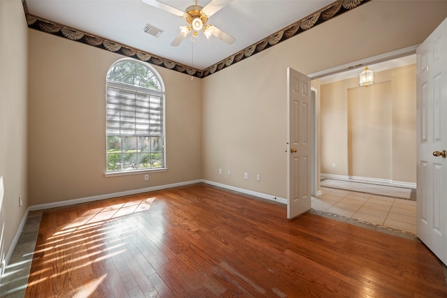 spare room featuring ceiling fan and wood-type flooring