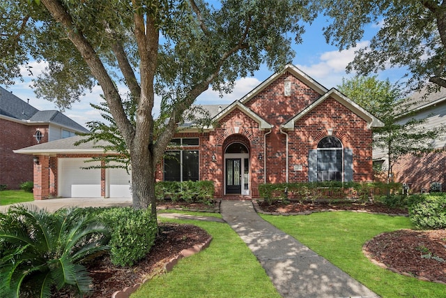 view of front facade with a front yard and a garage