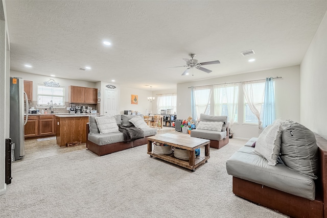 living room with light colored carpet and a healthy amount of sunlight