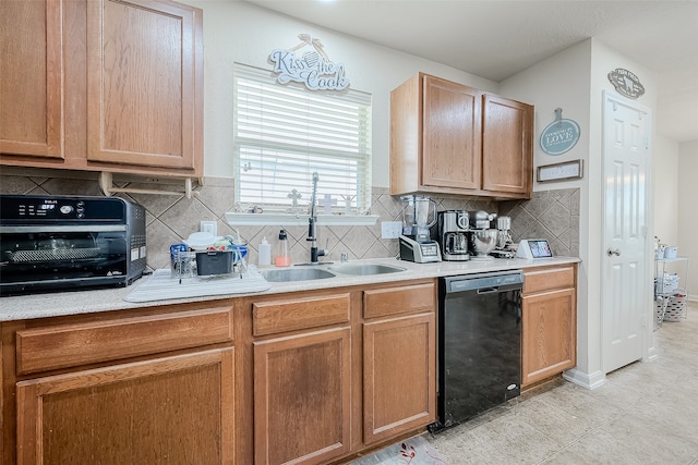 kitchen featuring sink, light tile patterned floors, dishwasher, and tasteful backsplash