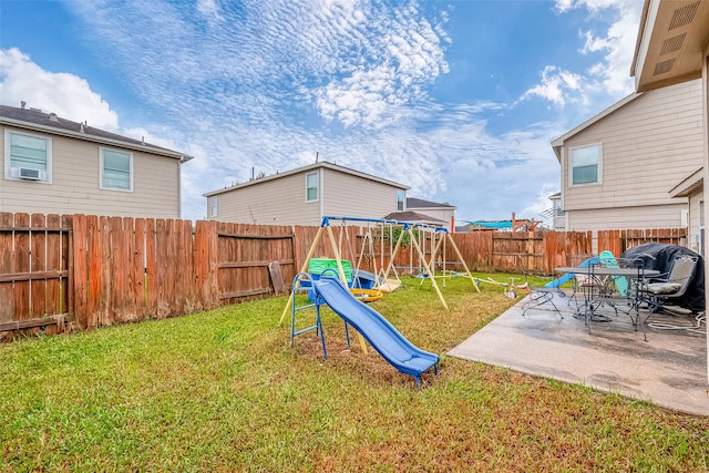 view of play area with cooling unit, a patio, and a yard