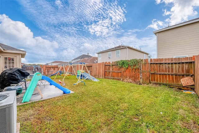 view of yard featuring a playground and cooling unit