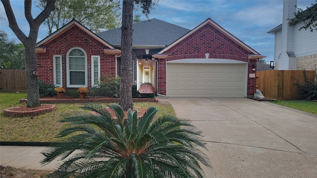 view of front facade with a garage and a front lawn