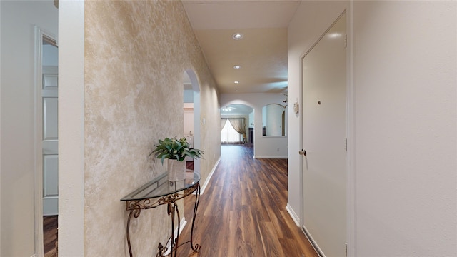 hall with dark hardwood / wood-style floors