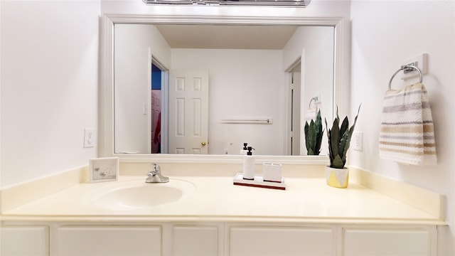 bathroom featuring vanity and an AC wall unit