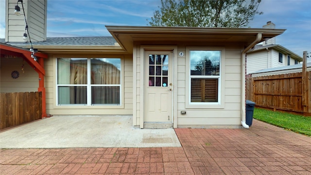 entrance to property featuring a patio area