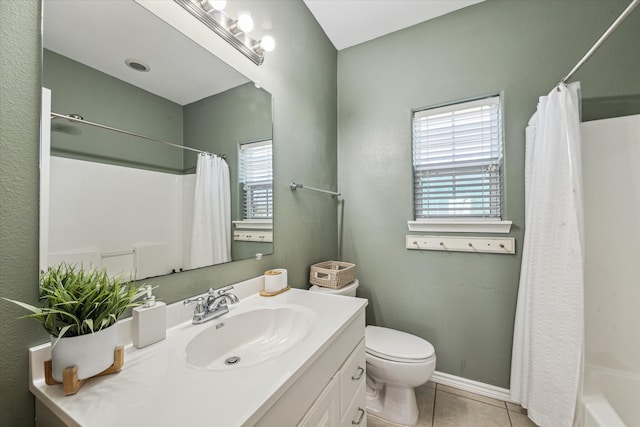 full bathroom with tile patterned flooring, vanity, toilet, and shower / bath combo with shower curtain