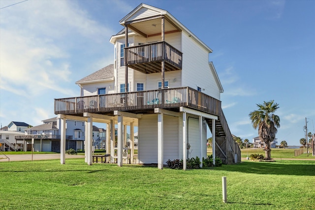 rear view of property with a deck and a yard