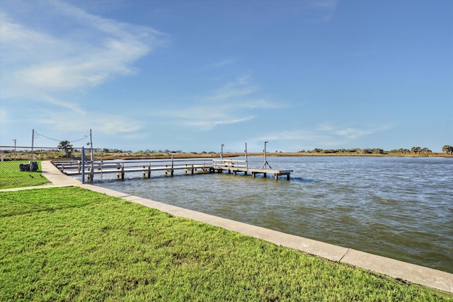 dock area featuring a yard and a water view