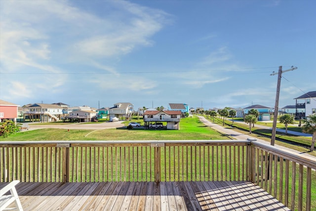 wooden terrace with a yard