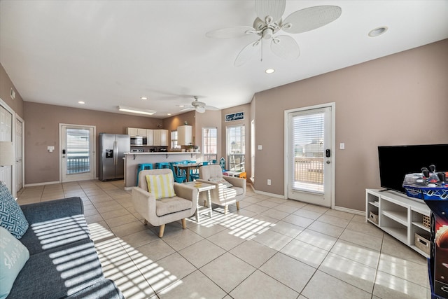 living room featuring plenty of natural light and light tile patterned floors