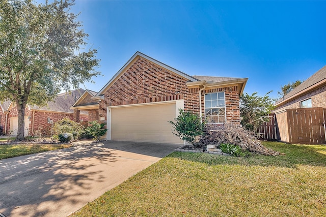 view of front of property featuring a garage and a front lawn