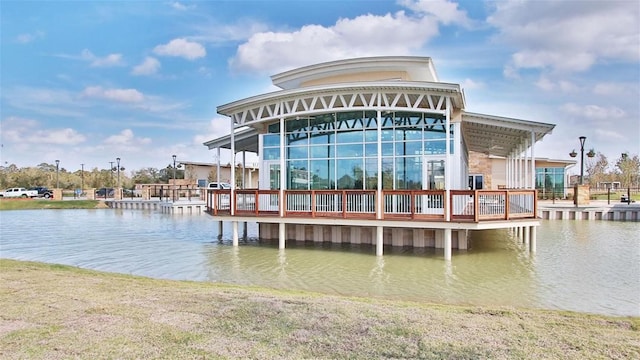 view of dock featuring a deck with water view