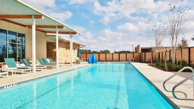 view of swimming pool featuring a patio