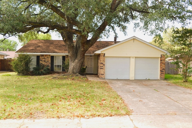 ranch-style home featuring a garage and a front lawn