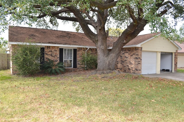 single story home with a garage and a front yard