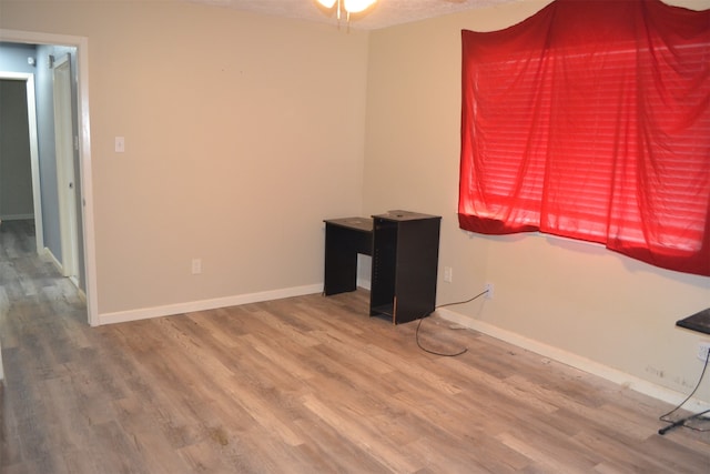 interior space featuring hardwood / wood-style flooring and ceiling fan