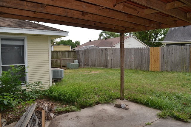 view of yard with a patio area and central AC