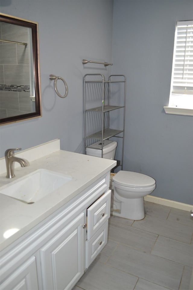 bathroom featuring vanity and toilet