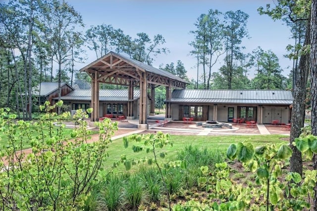 back of house featuring a patio and a gazebo