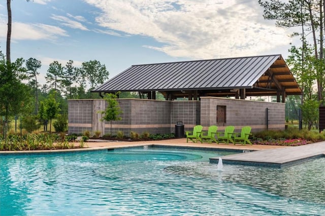 view of pool featuring pool water feature