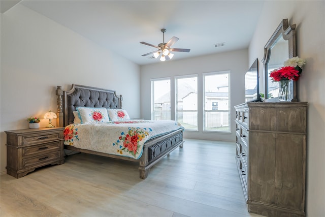 bedroom with light wood-type flooring and ceiling fan