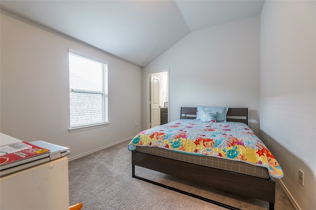 carpeted bedroom featuring lofted ceiling