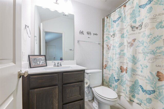 full bathroom with shower / bath combo, vanity, toilet, and vaulted ceiling