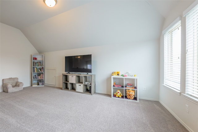 playroom featuring carpet and lofted ceiling