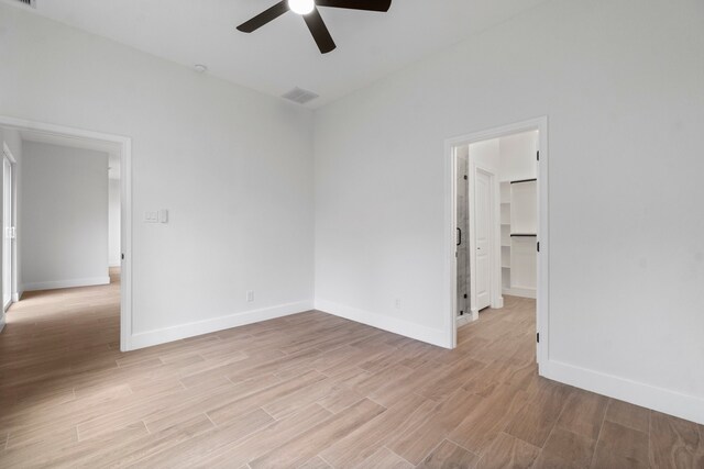 spare room featuring ceiling fan and light hardwood / wood-style floors