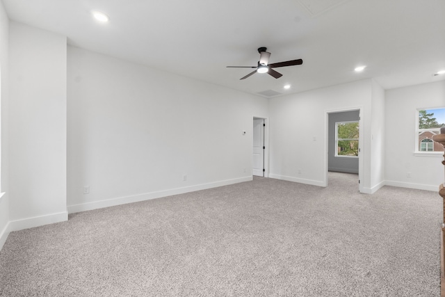 empty room with light colored carpet and ceiling fan