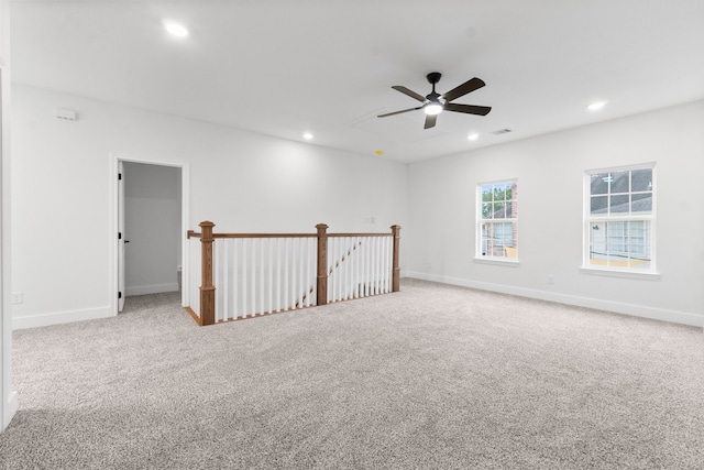 empty room with light carpet and ceiling fan