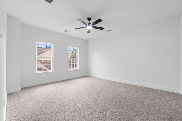 carpeted empty room featuring ceiling fan