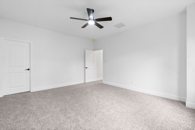 empty room with carpet flooring and ceiling fan